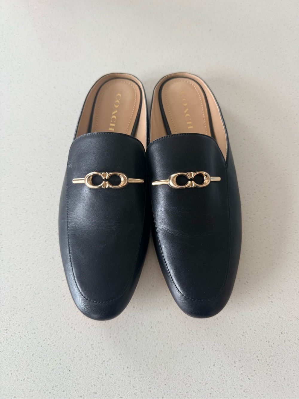 Never worn COACH Black Leather Slip-On Loafers with Gold Hardware
